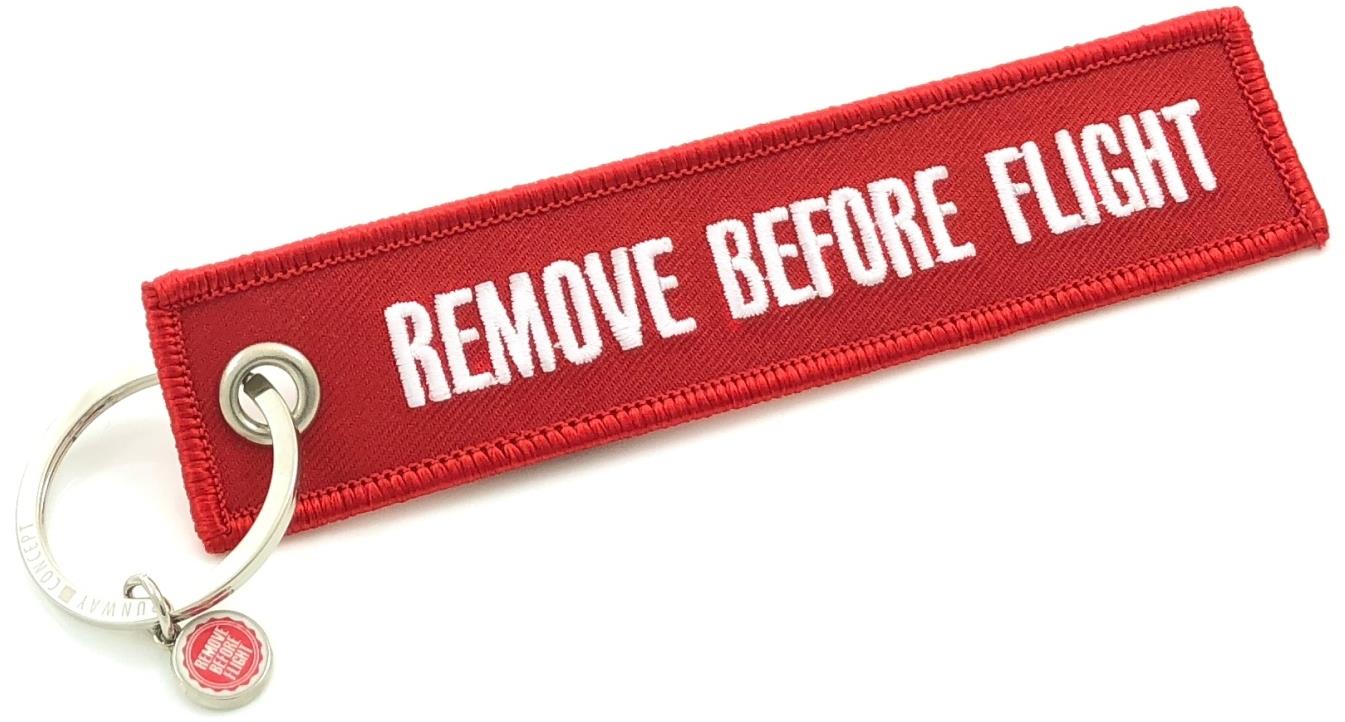 RBF Originals Kľúčenka Remove Before Flight, červená s bielym nápisom